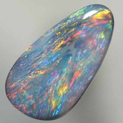 SOLID SEMI BLACK OPAL Red and orange sparkle over a green blue background